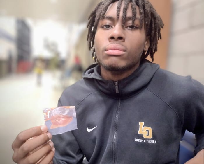 Los Osos' Deacon Toliver displays a small photo of his beloved late grandmother. Photo: John Murphy